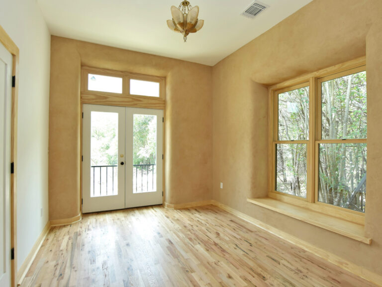 Custom Home Projects 45 Bright-Room-with-Large-Windows-and-Wooden-Floors
