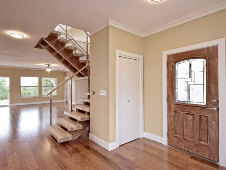 Remodeling Projects 24 Modern-Entryway-with-Wooden-Staircase