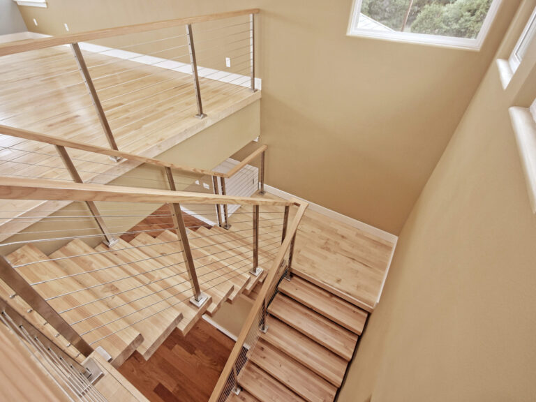 Remodeling Projects 27 Modern-Wooden-Staircase-with-Cable-Railings